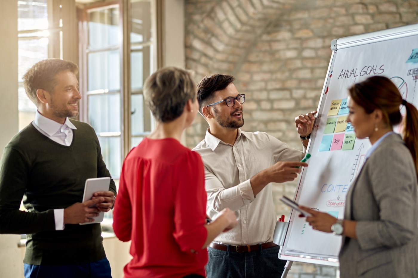 Team reviewing an AI agent evaluation budget at a whiteboard